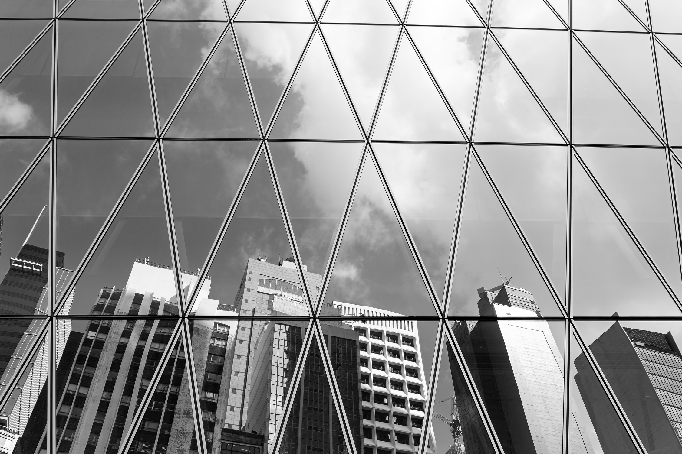 Mirrored office buildings (black and white)